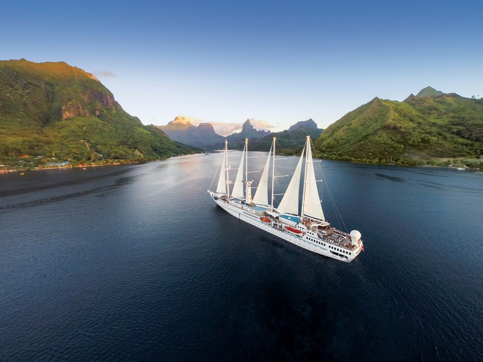 The Wind Spirit small cruise ship against the backdrop of the island of Moorea. Photo Windstar