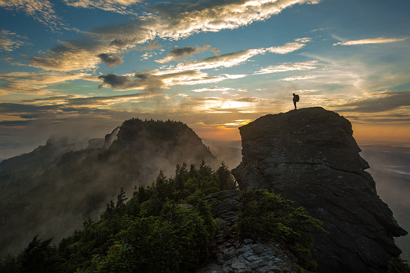 838_x_558_grandfather_mountain_sunrise_with_hiker