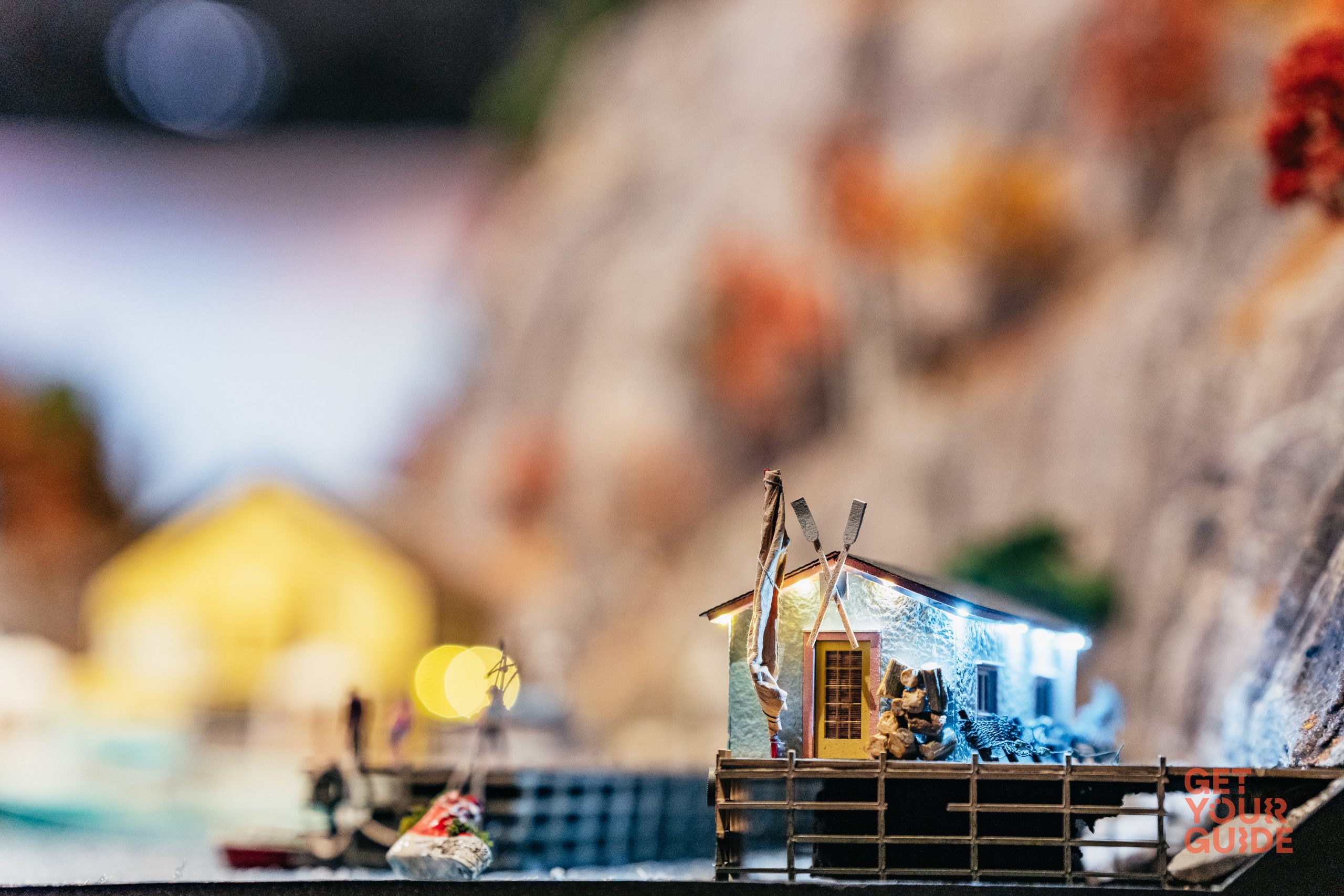 A miniature scene showing a tiny fishing hut